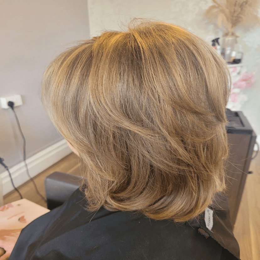 layered golden blonde bob back view