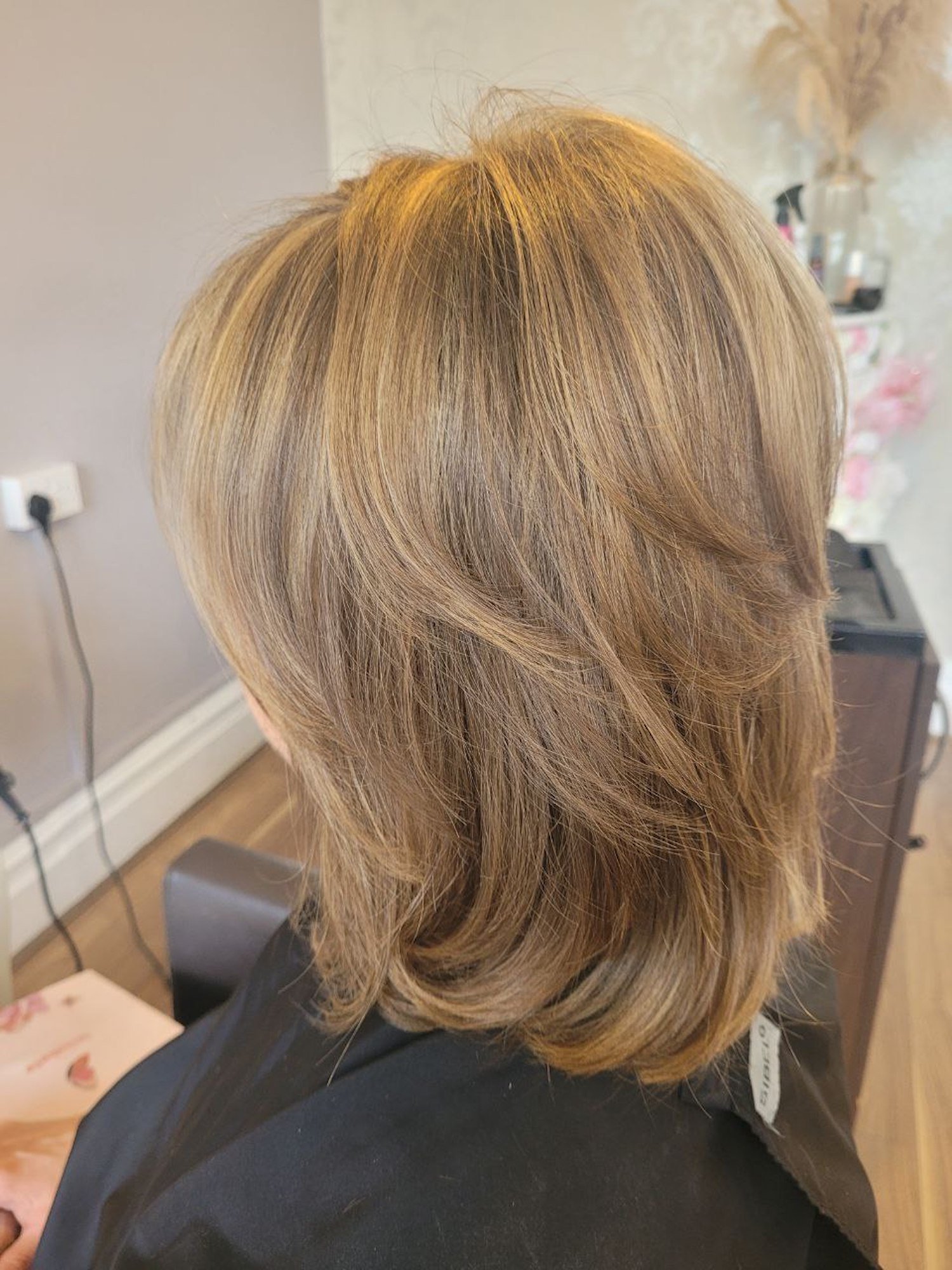 mid length straight bronde hair freshly coloured and styled