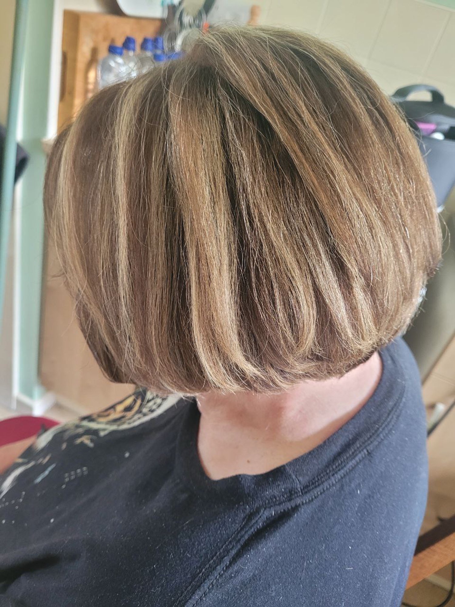 side view of bronde bobbed blonde-after-hair
